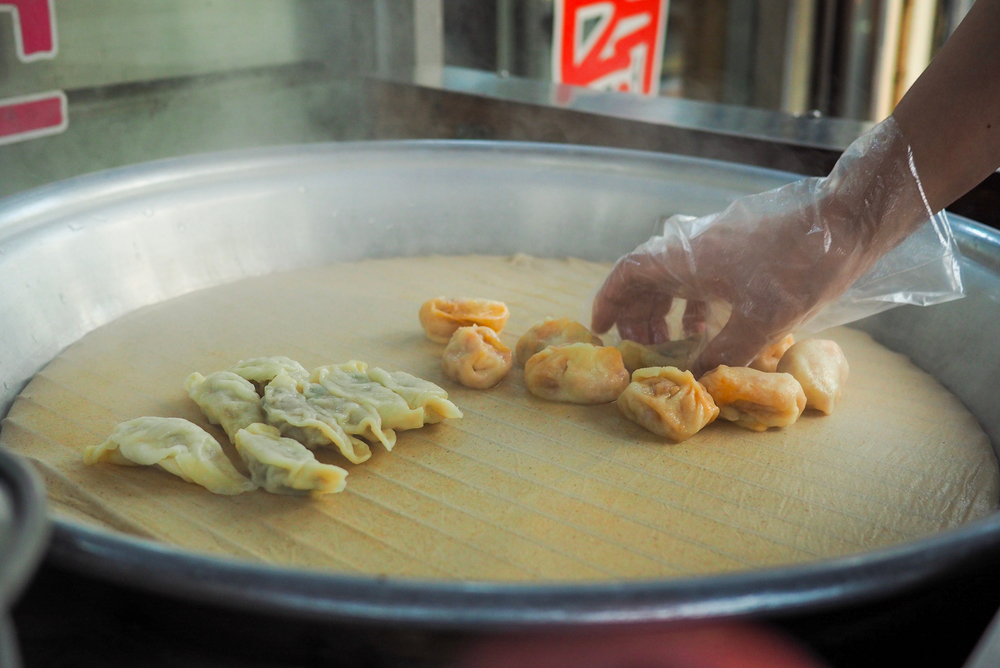 Korean street food: Mandu: steamed traditional dumplings, South Korea.