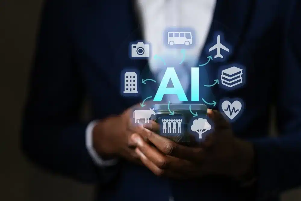 A person holding a phone with the word AI floating on top of it and digital travel-related icons floating around it.